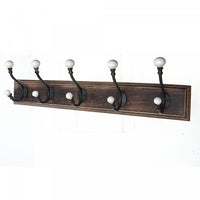 5 Iron Hooks with Ceramic Knobs on Wood Base